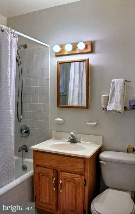 54 Ridge Road, Unit B Greenbelt, MD 20770 - Photo 6 of 9 a bathroom with a sink toilet and shower