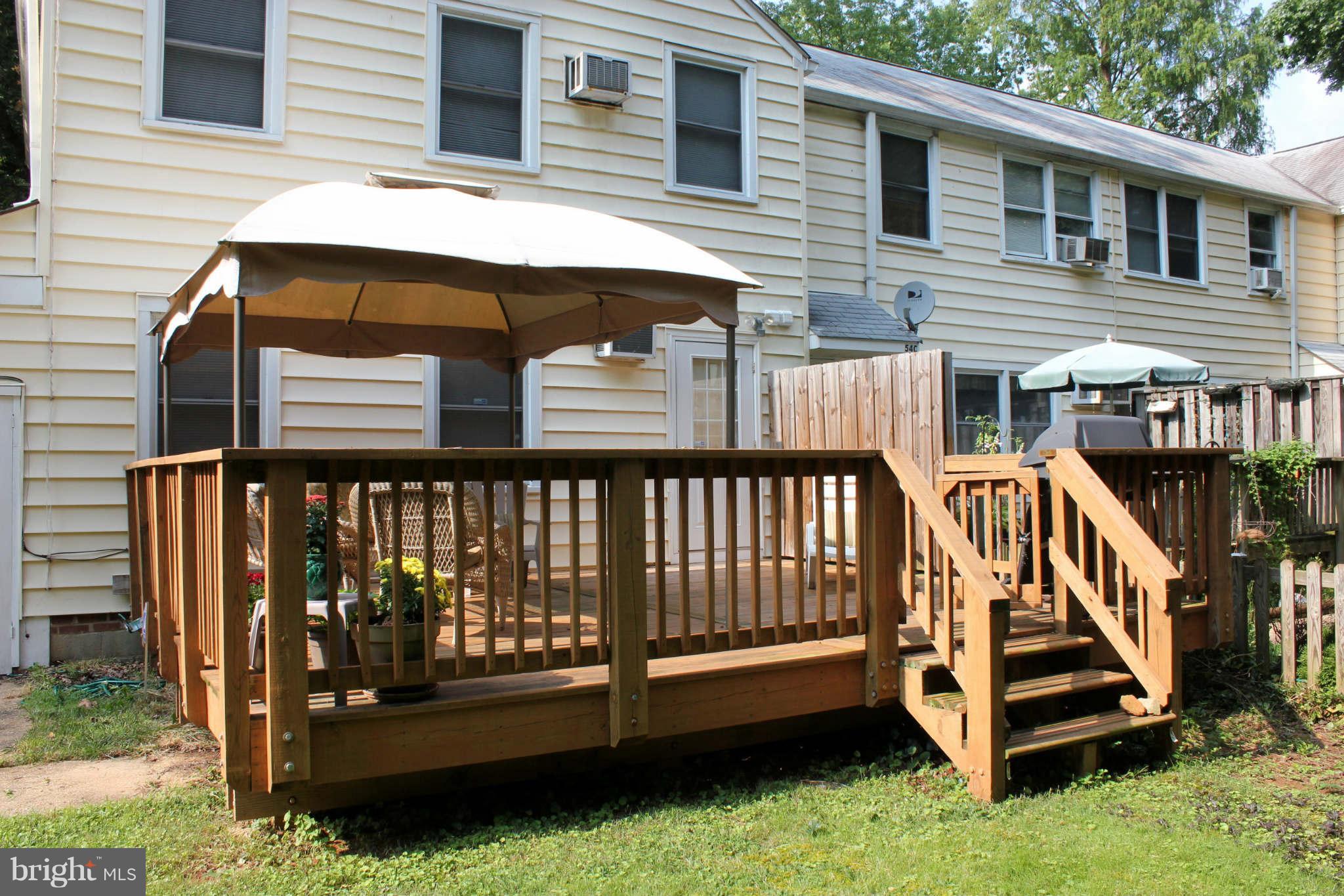 54 Ridge Road, Unit B Greenbelt, MD 20770 - Photo 7 of 9 a view of a house with a yard and deck