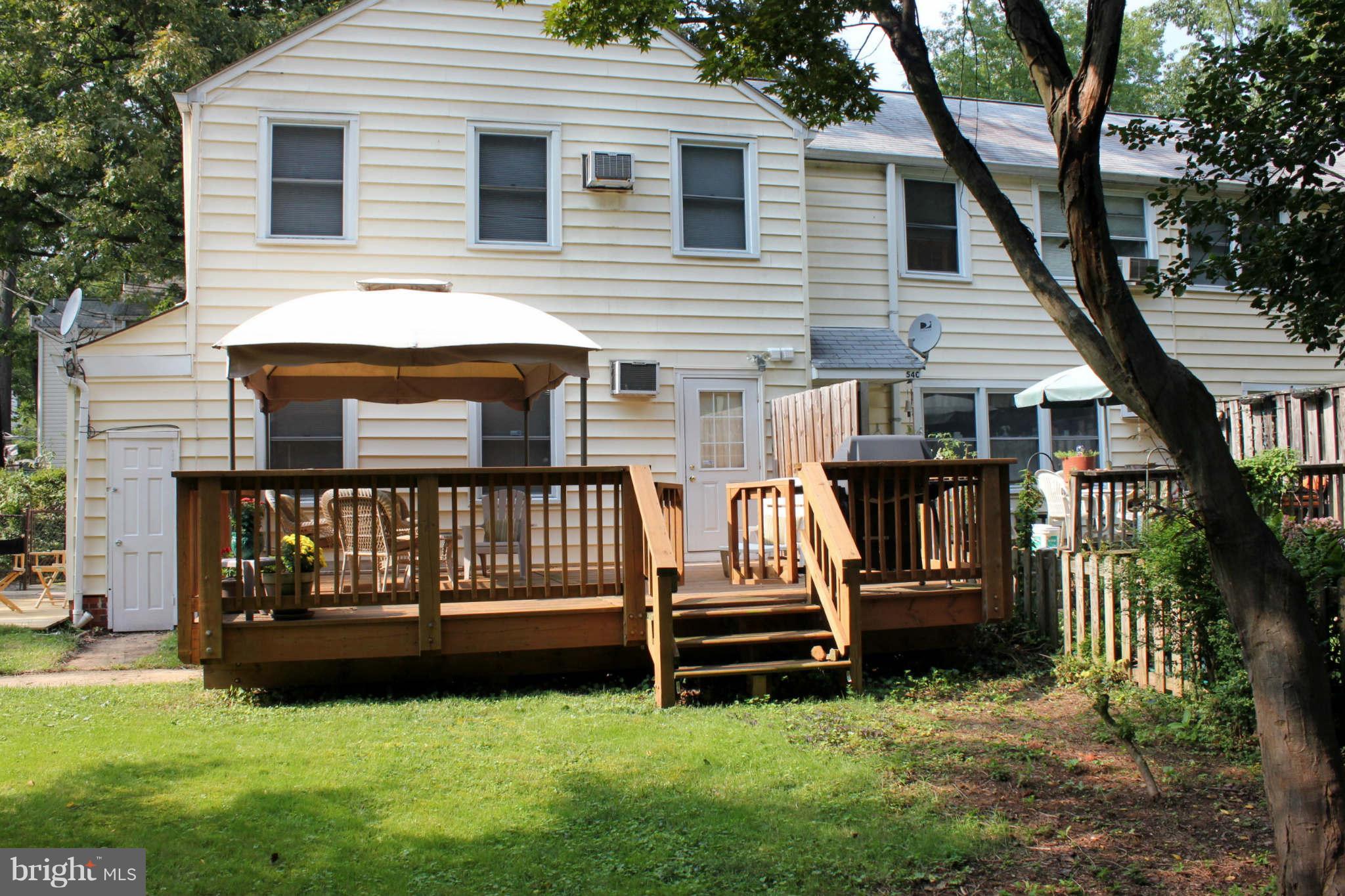 54 Ridge Road, Unit B Greenbelt, MD 20770 - Photo 9 of 9 a front view of a house with garden