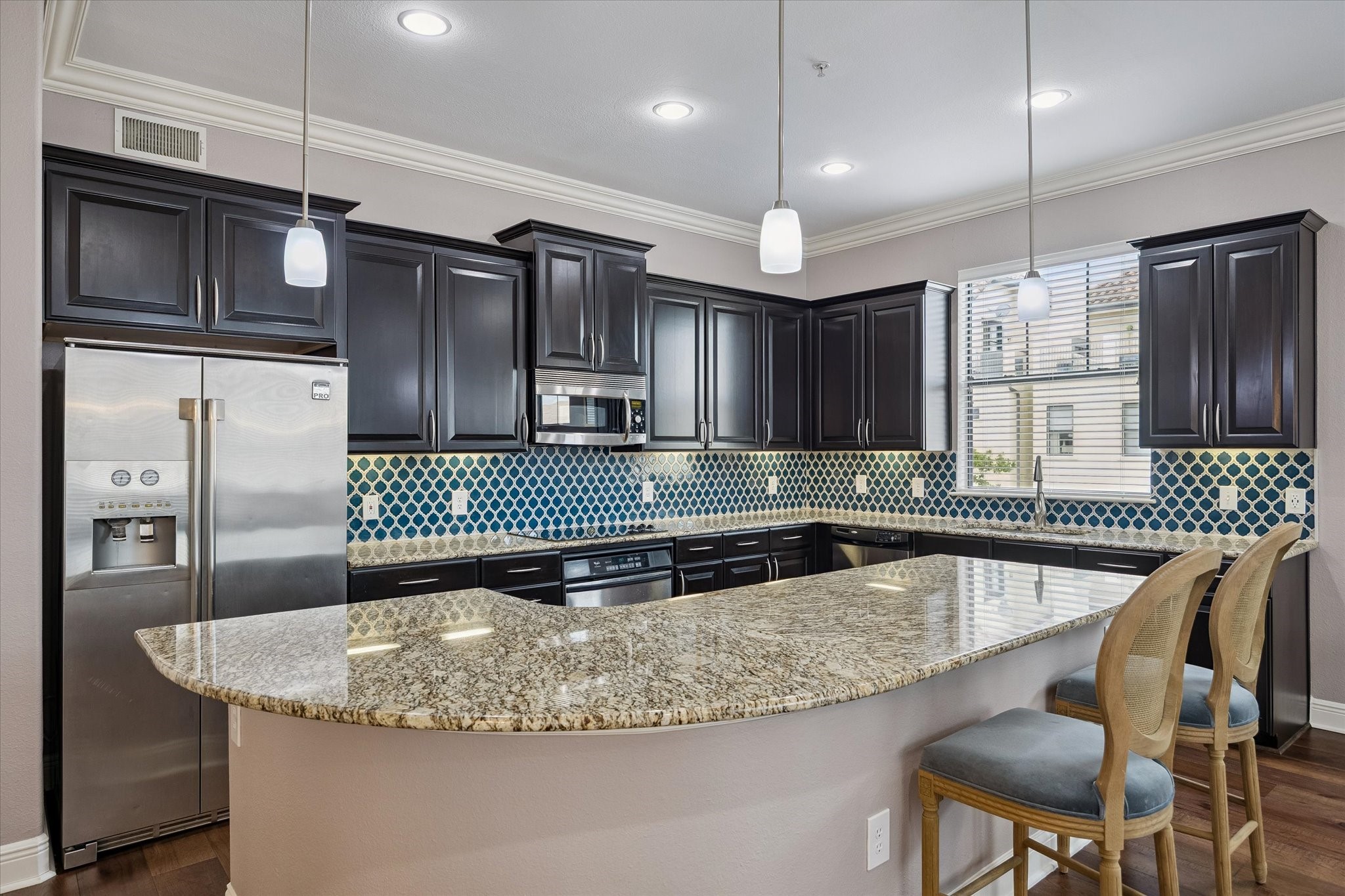 2120 Kipling Street, Unit 304 Houston, TX 77098 - Photo 6 of 24 Designed for both everyday living and entertaining, the kitchen features granite countertops, stainless steel appliances and a breakfast bar island perfect for casual dining or gathering with friends. Ample cabinetry and country space add both style and functionality.