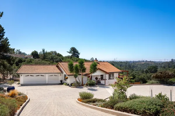 a front view of a house with a garage