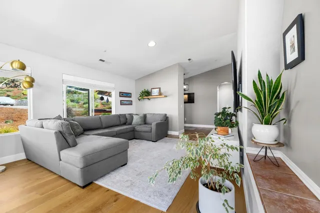a view of a dining room with furniture wooden floor and chandelier