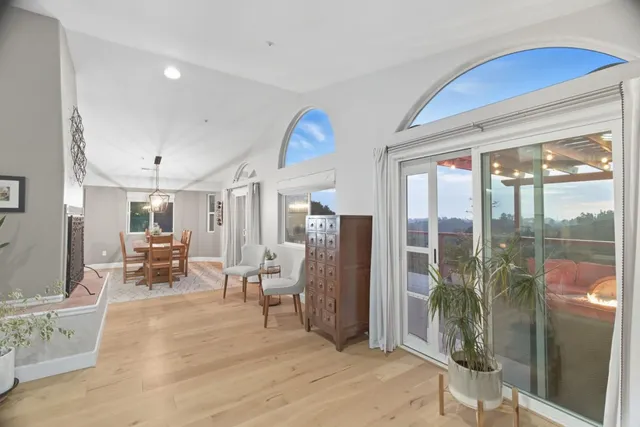 a view of a dining room with furniture window and wooden floor