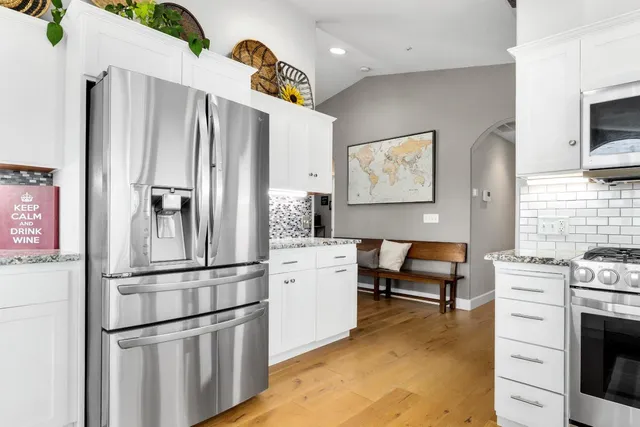 a bedroom with a bed and a television