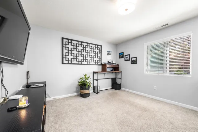 a bathroom with a granite countertop sink a toilet and bathtub