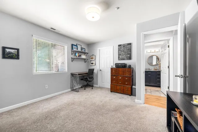 a bathroom with a granite countertop sink a toilet and bathtub