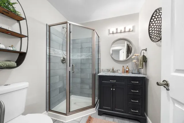 a bedroom with a bed and a desk