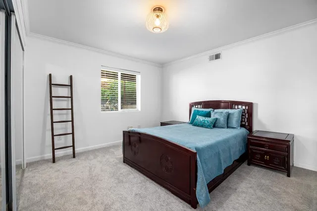 a bathroom with a granite countertop sink a mirror and shower