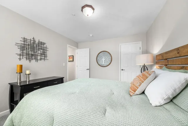 a view of a balcony with chairs and wooden floor
