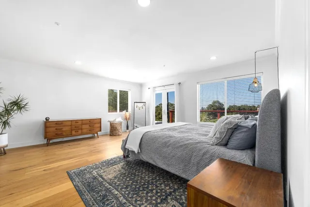 an aerial view of a house with yard and mountain view in back
