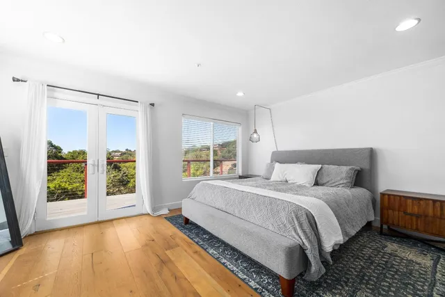 an aerial view of residential house with outdoor space and trees