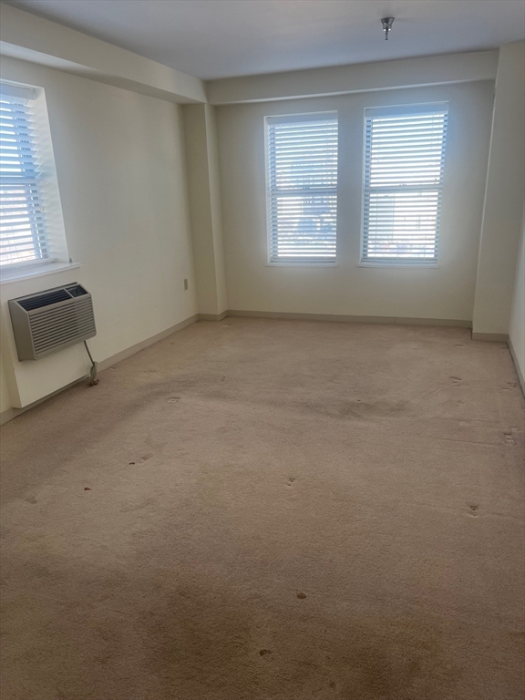 750 Davol Street, Unit 221 Fall River, MA 02720 - Photo 15 of 19 a view of an empty room with a window