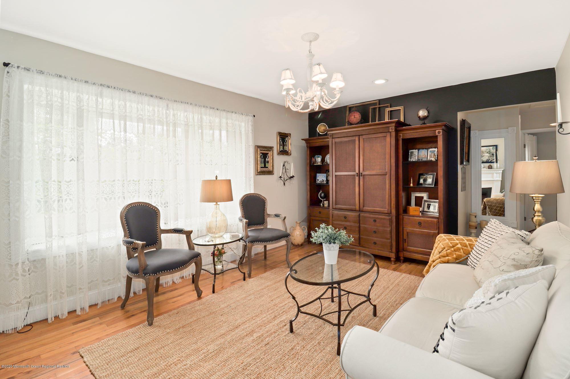 30 Wickatunk Road Manalapan, NJ 07726 - Photo 12 of 31 a living room with furniture and wooden floor