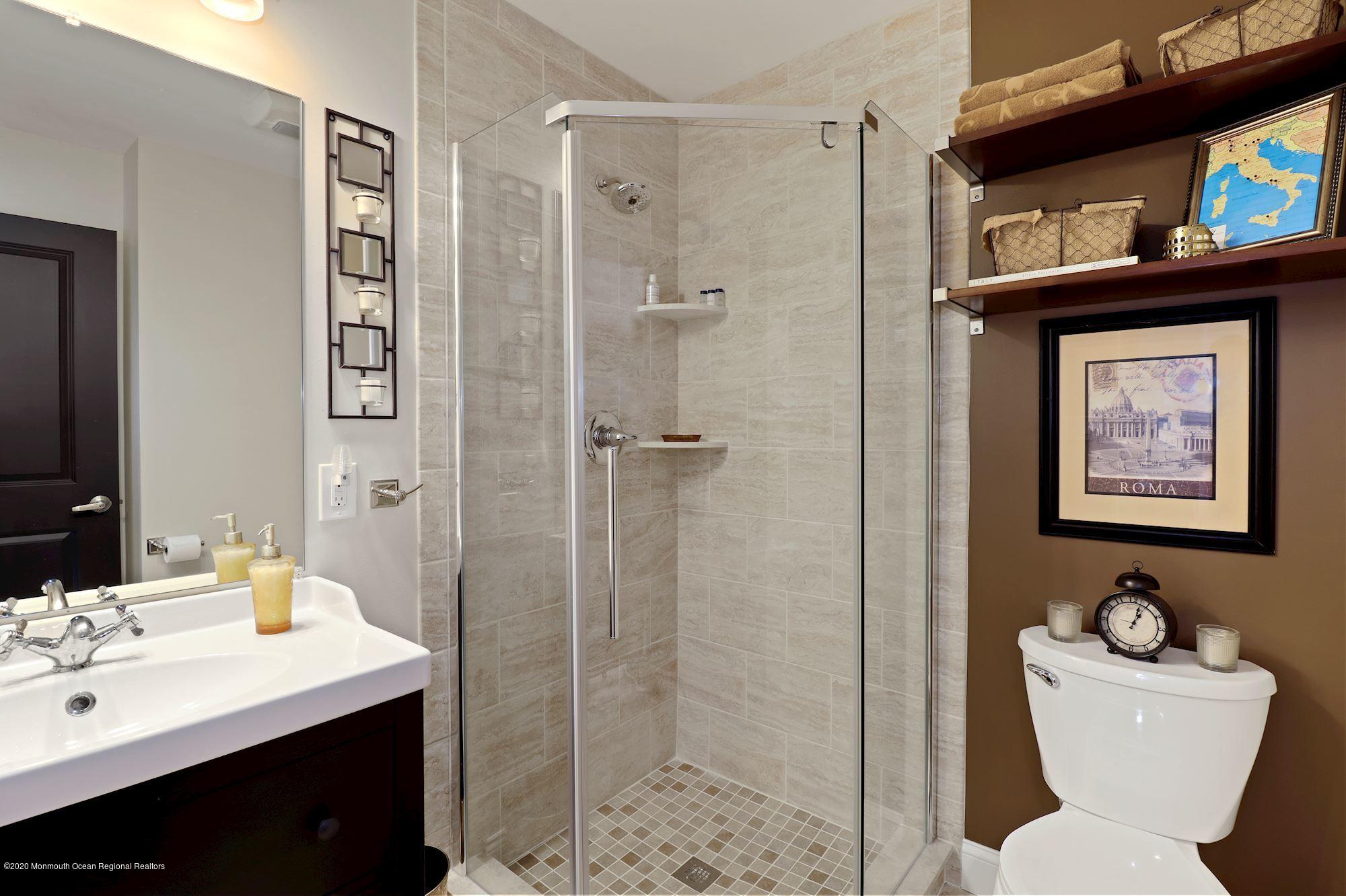 30 Wickatunk Road Manalapan, NJ 07726 - Photo 19 of 31 a bathroom with a toilet sink and shower