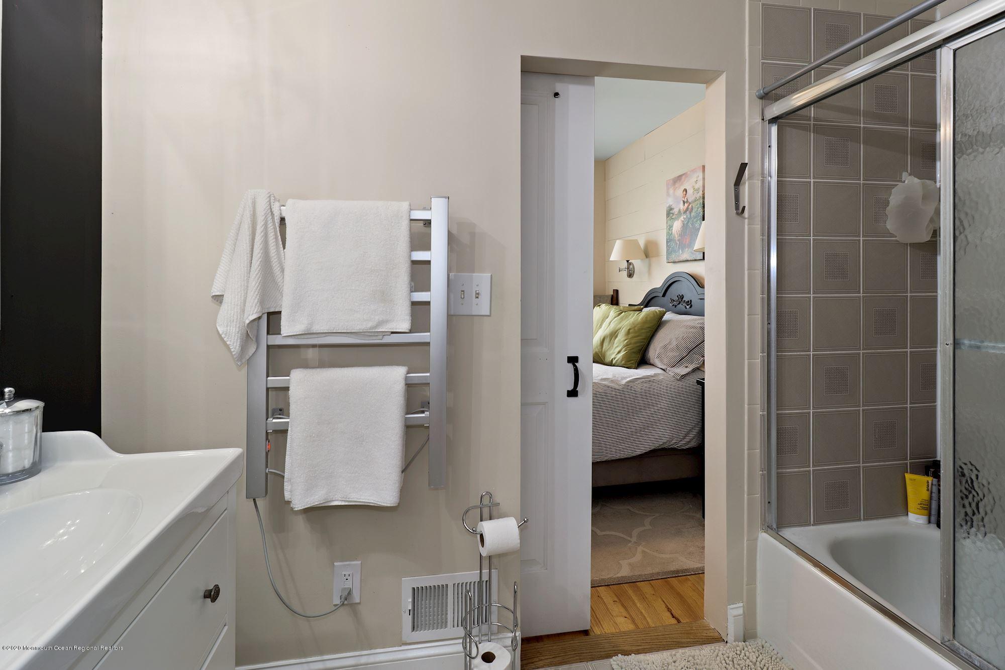 30 Wickatunk Road Manalapan, NJ 07726 - Photo 20 of 31 a bathroom with a bathtub and shower