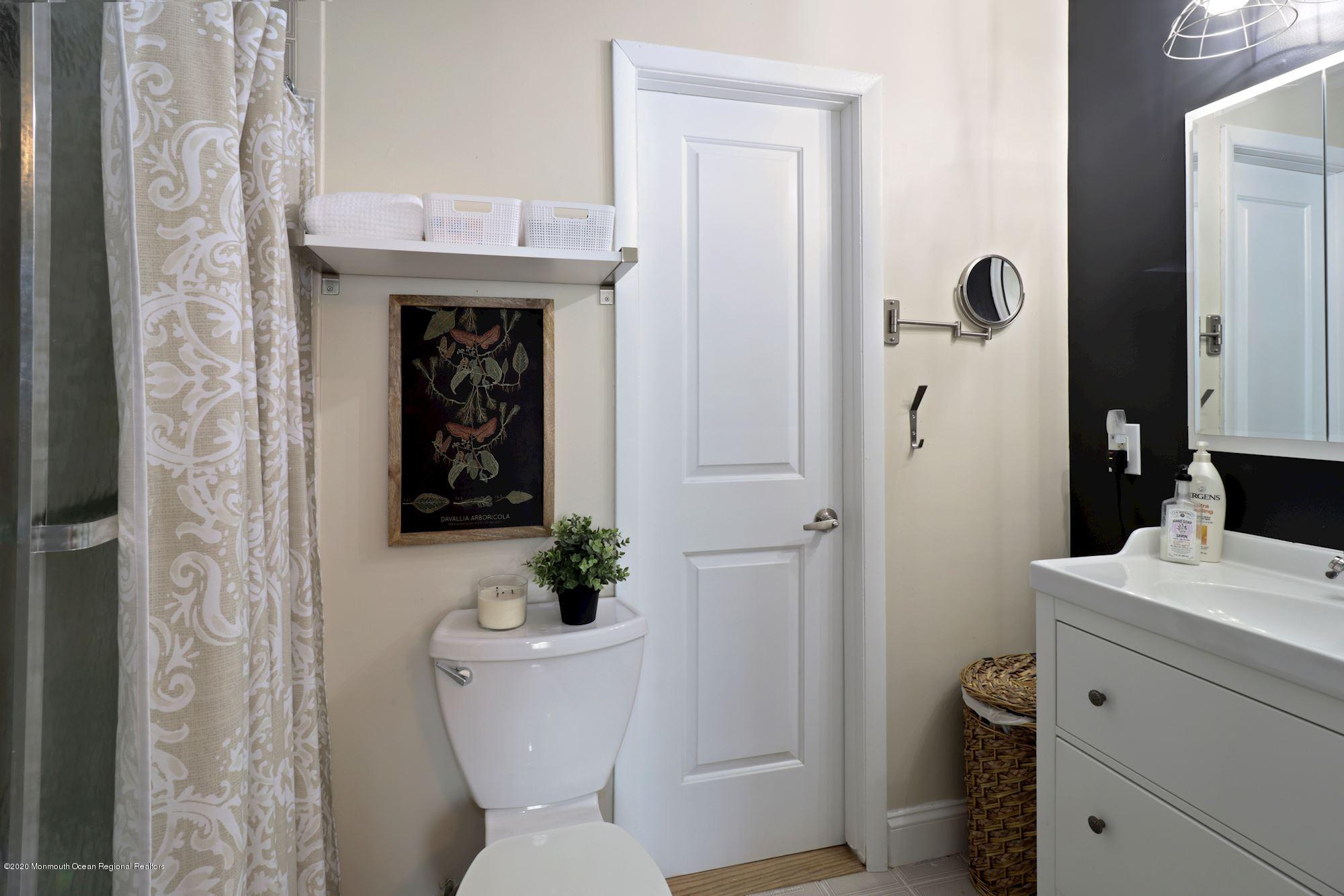 30 Wickatunk Road Manalapan, NJ 07726 - Photo 21 of 31 a bathroom with a sink toilet and shower