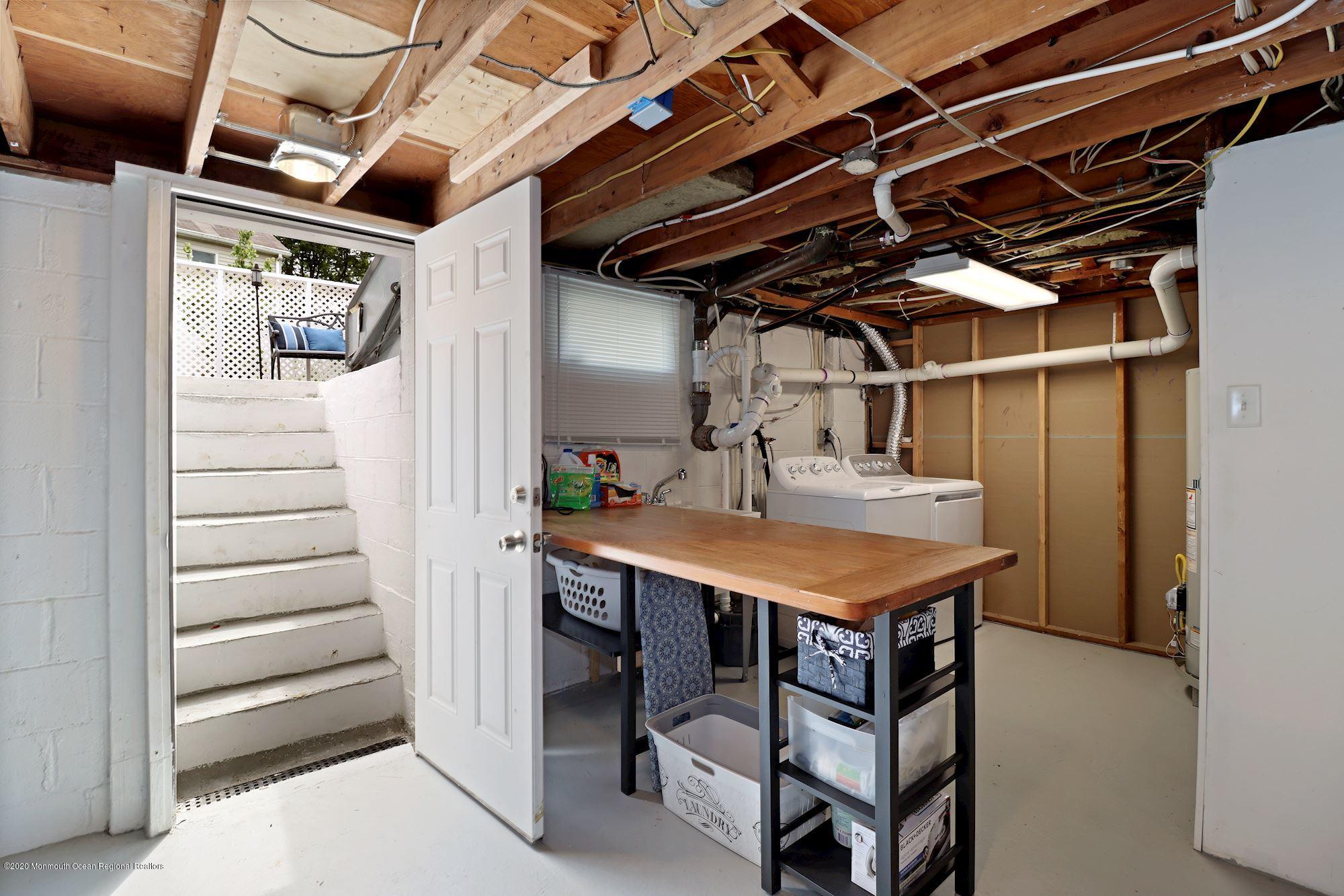 30 Wickatunk Road Manalapan, NJ 07726 - Photo 22 of 31 a utility room with dryer and washer
