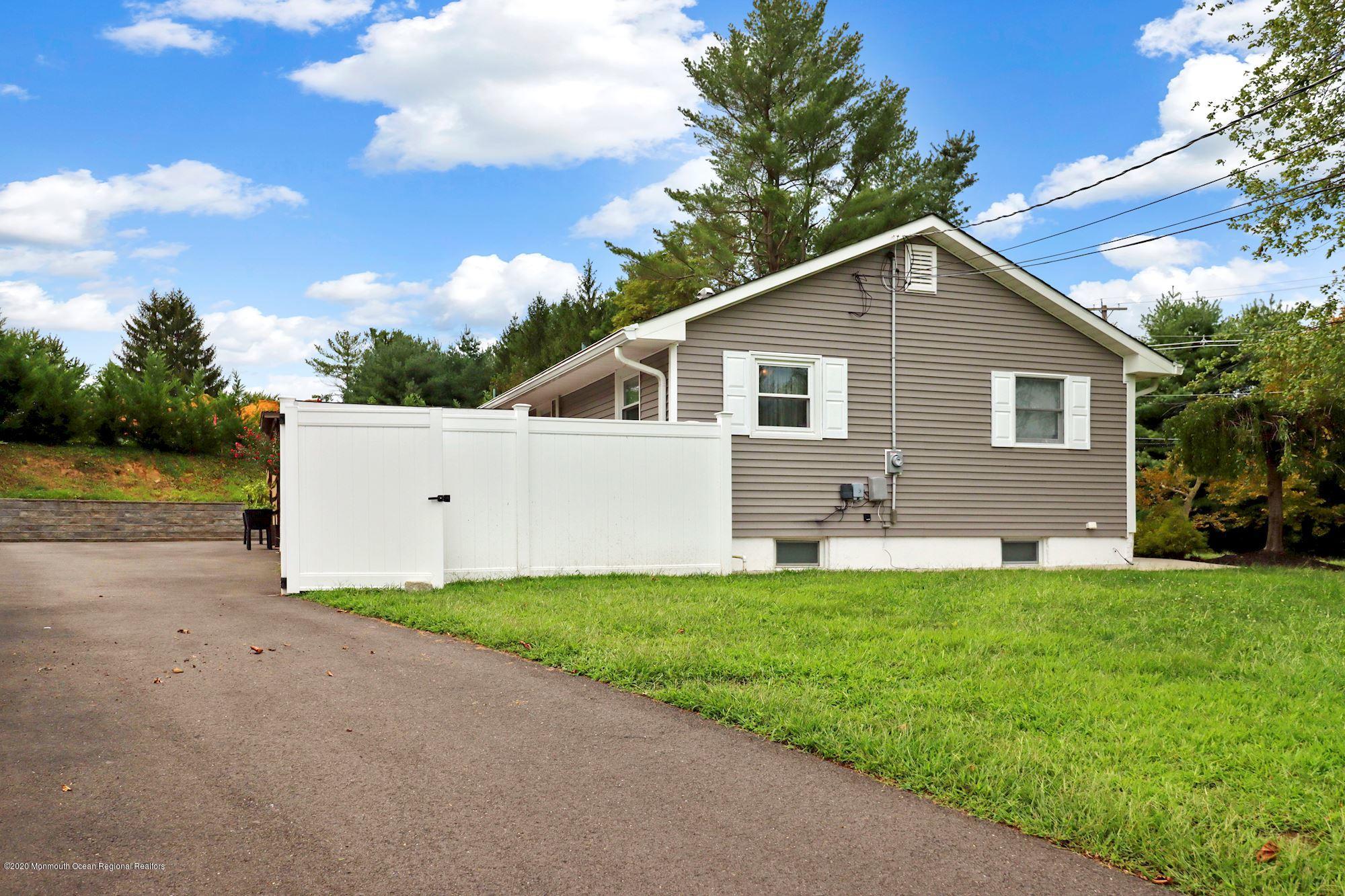 30 Wickatunk Road Manalapan, NJ 07726 - Photo 24 of 31 a view of a house with a yard