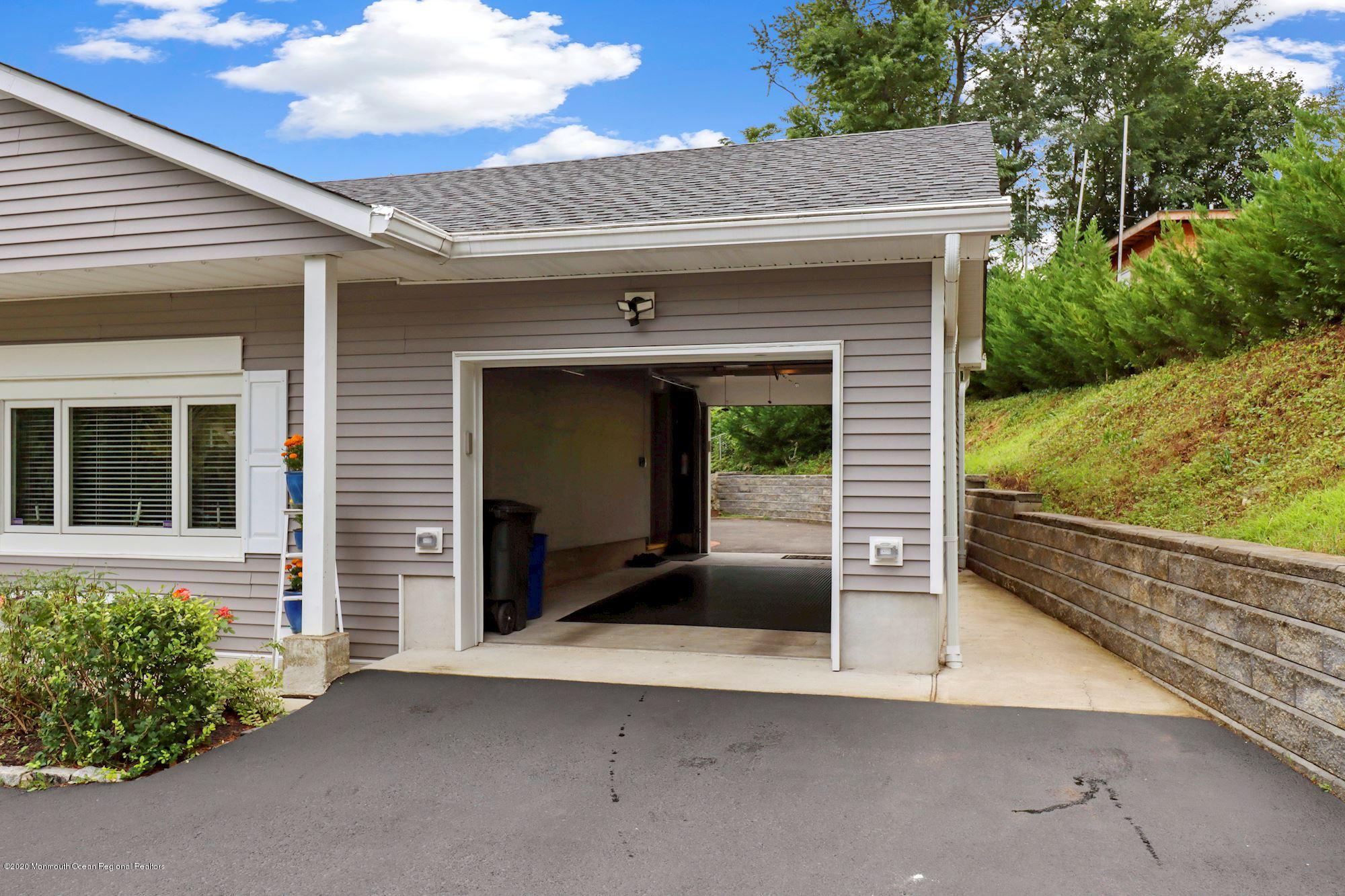 30 Wickatunk Road Manalapan, NJ 07726 - Photo 28 of 31 a front view of a house with garden