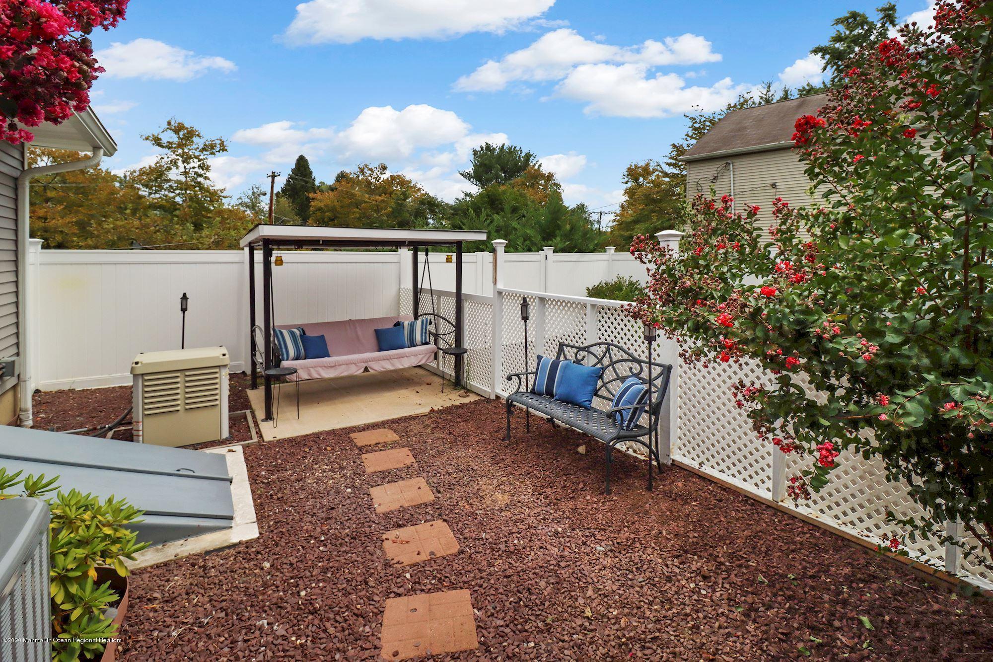 30 Wickatunk Road Manalapan, NJ 07726 - Photo 30 of 31 a view of a backyard with sitting area