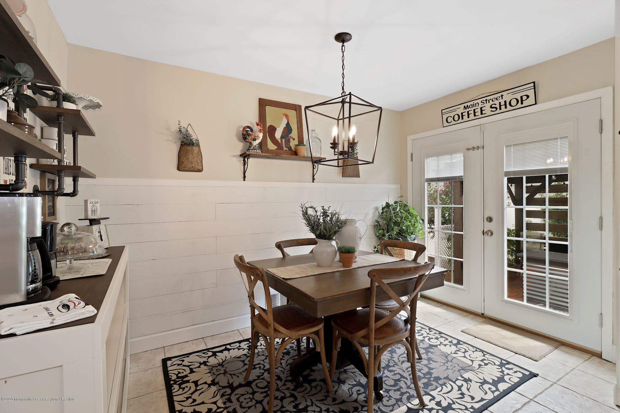30 Wickatunk Road Manalapan, NJ 07726 - Photo 4 of 31 a view of a dining room with furniture and wooden floor