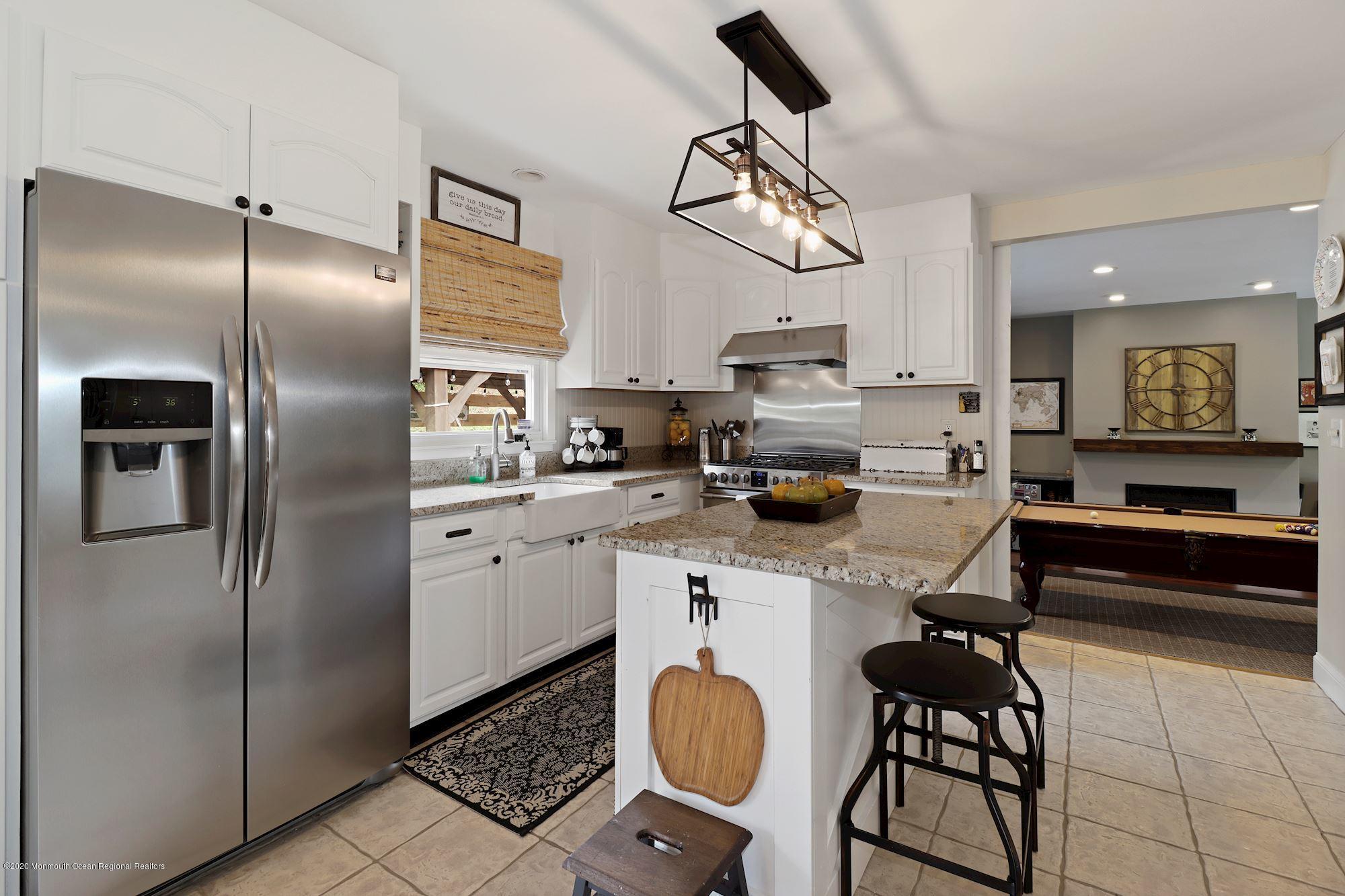 30 Wickatunk Road Manalapan, NJ 07726 - Photo 6 of 31 a kitchen with stainless steel appliances a refrigerator sink and cabinets