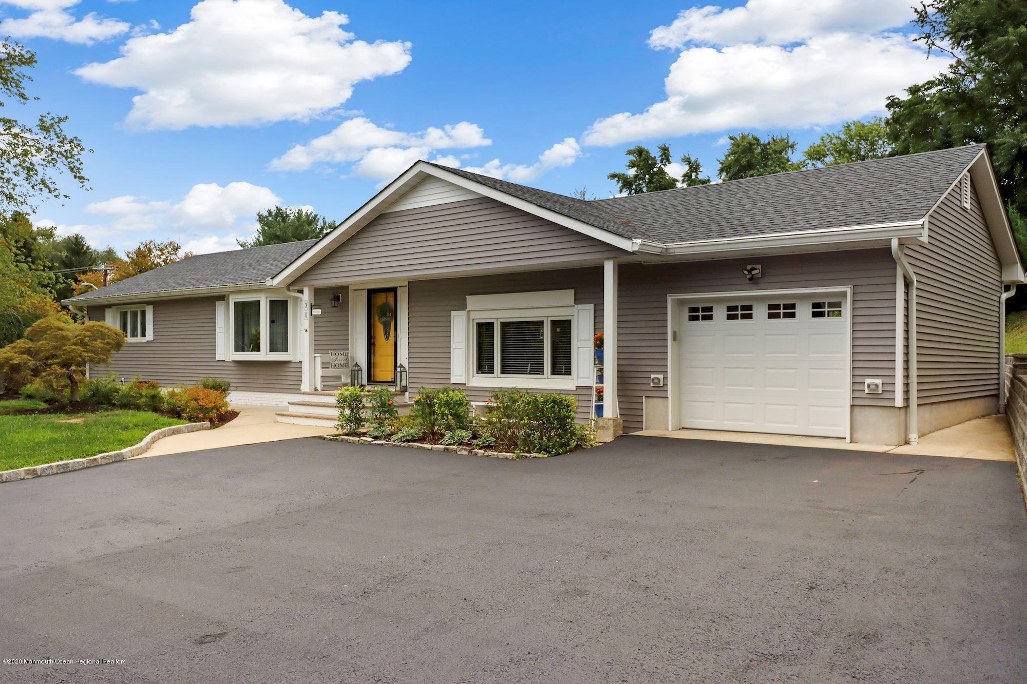 30 Wickatunk Road Manalapan, NJ 07726 - Photo 9 of 31 a front view of a house with porch