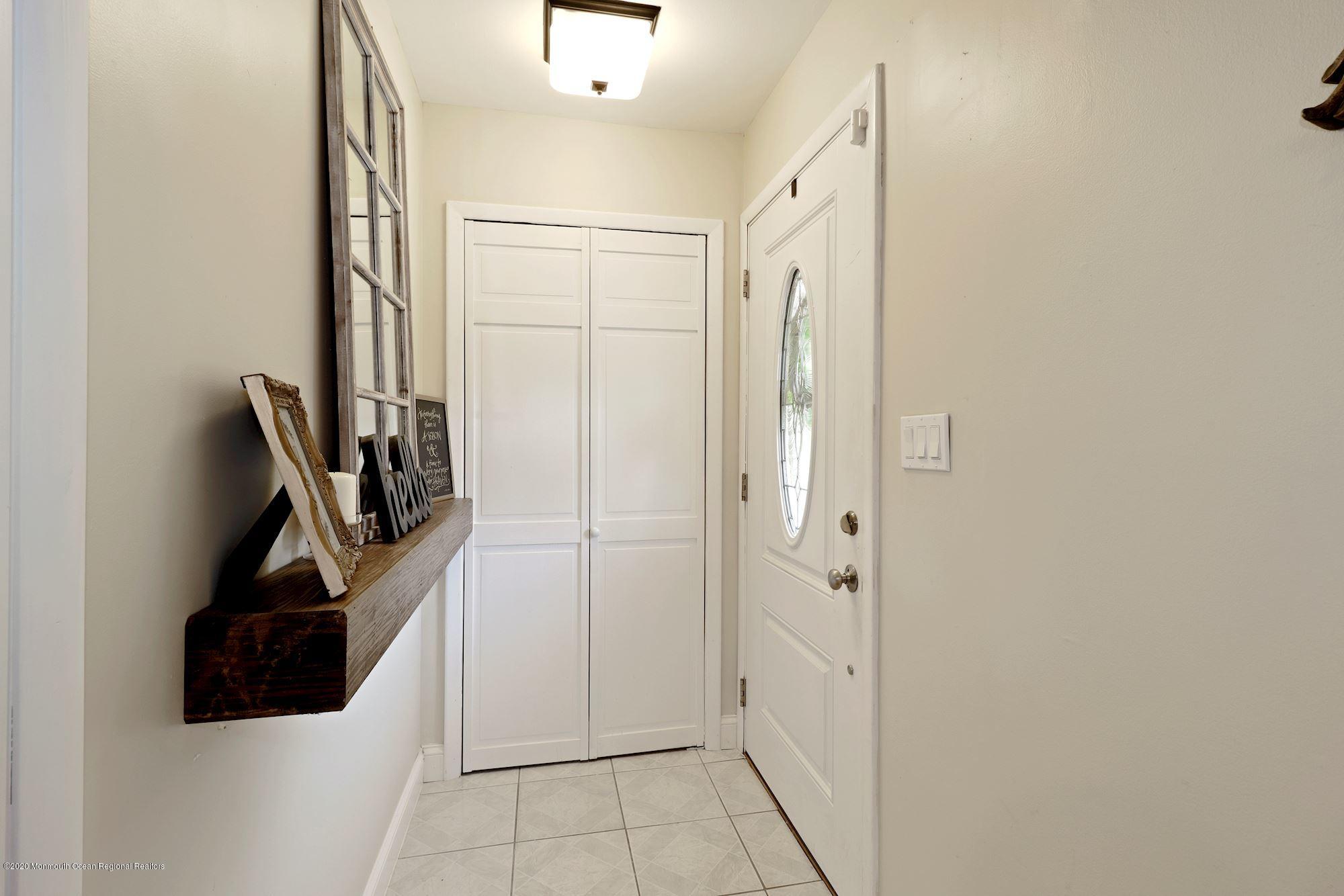 30 Wickatunk Road Manalapan, NJ 07726 - Photo 10 of 31 a view of an entryway with wooden floor