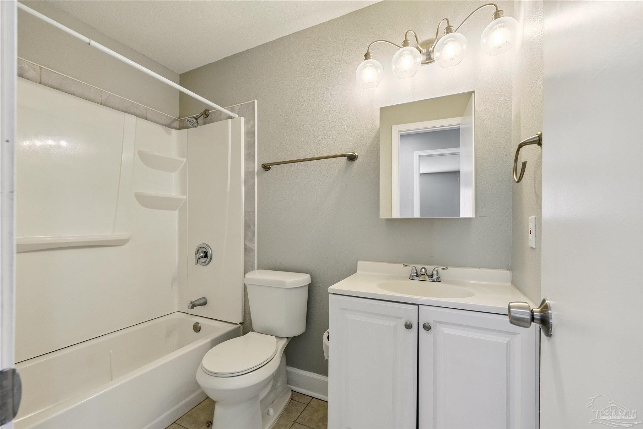 4250 Avenida San Marcus Pace, FL 32571 - Photo 15 of 23 a bathroom with a sink toilet and shower