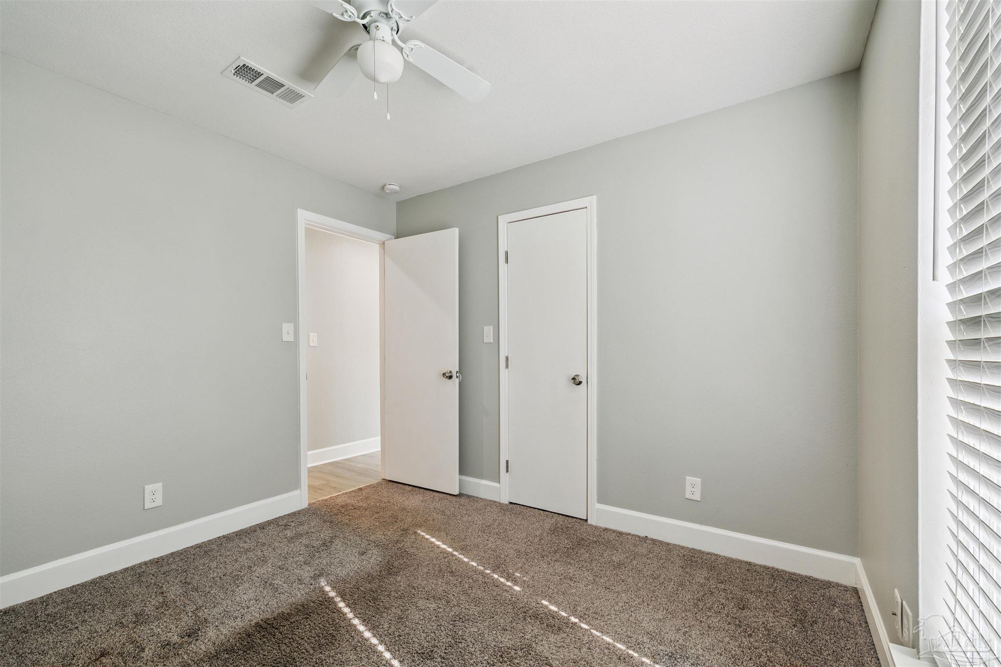 4250 Avenida San Marcus Pace, FL 32571 - Photo 17 of 23 a view of an empty room with a window