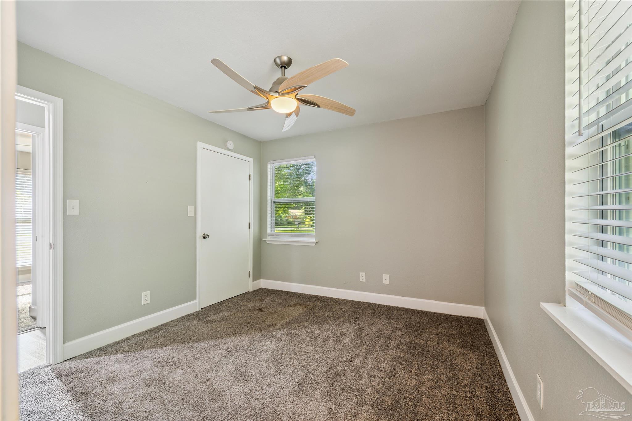 4250 Avenida San Marcus Pace, FL 32571 - Photo 18 of 23 a view of an empty room with a window