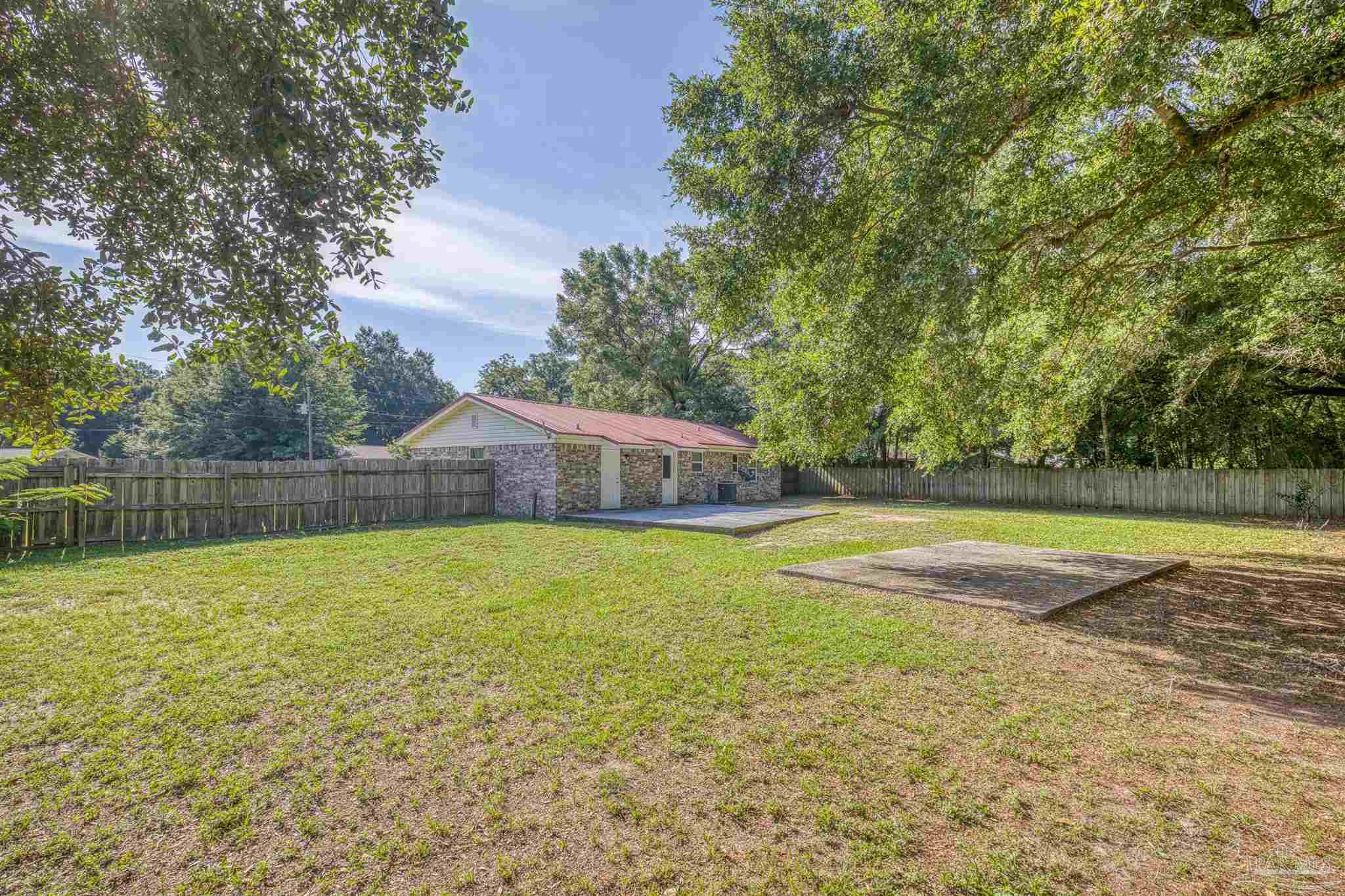 4250 Avenida San Marcus Pace, FL 32571 - Photo 5 of 23 a view of a swimming pool with a yard