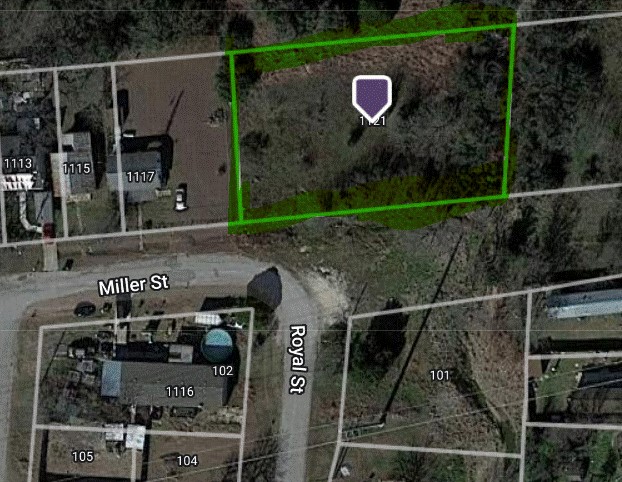 1121 Miller Street Taylor, TX 76574 - Photo 10 of 12 a view of a house with a street