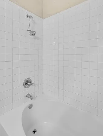 a bathroom with a white bathtub