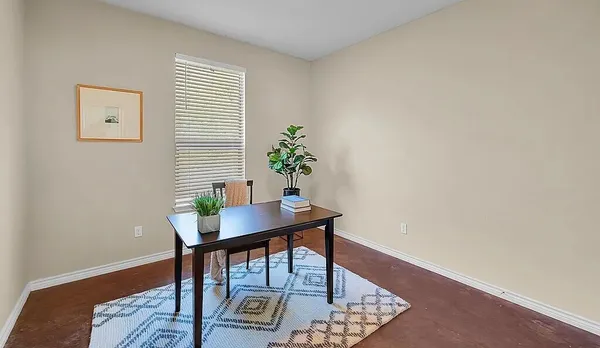 a view of a workspace with furniture