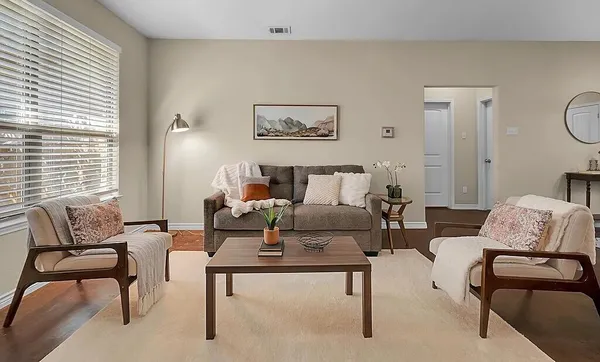 a living room with furniture and a window