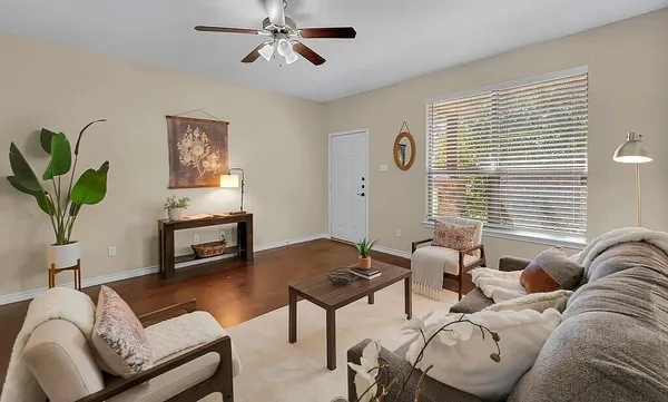 a living room with furniture and a window
