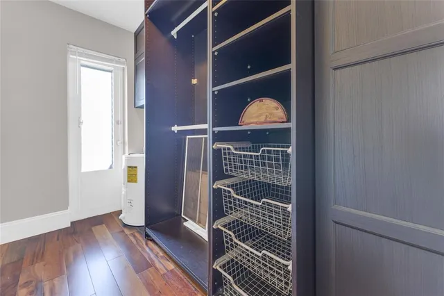 a view of a door and wooden floor