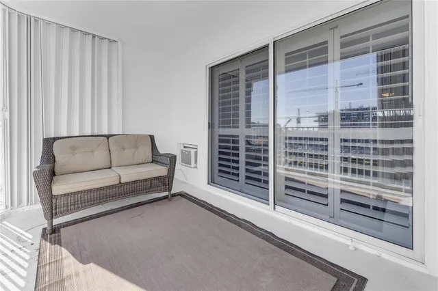 a view of a balcony with wooden floor