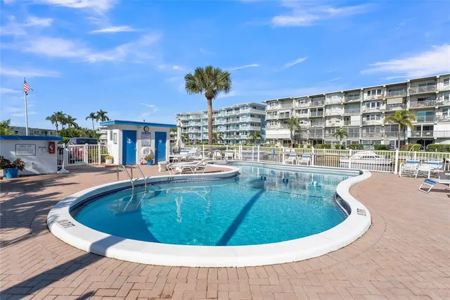 a view of a swimming pool with a patio