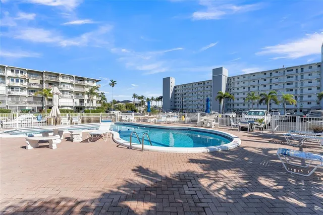 a view of a swimming pool with seating area
