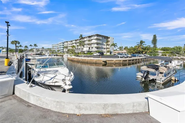 a swimming pool view with a outdoor seating space
