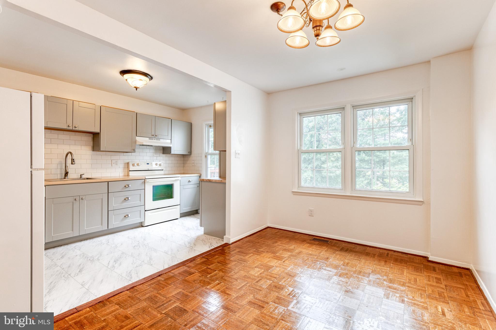 3429 Saluda Road Nottingham, MD 21236 - Photo 13 of 37 a kitchen with stainless steel appliances granite countertop a stove a sink and a refrigerator