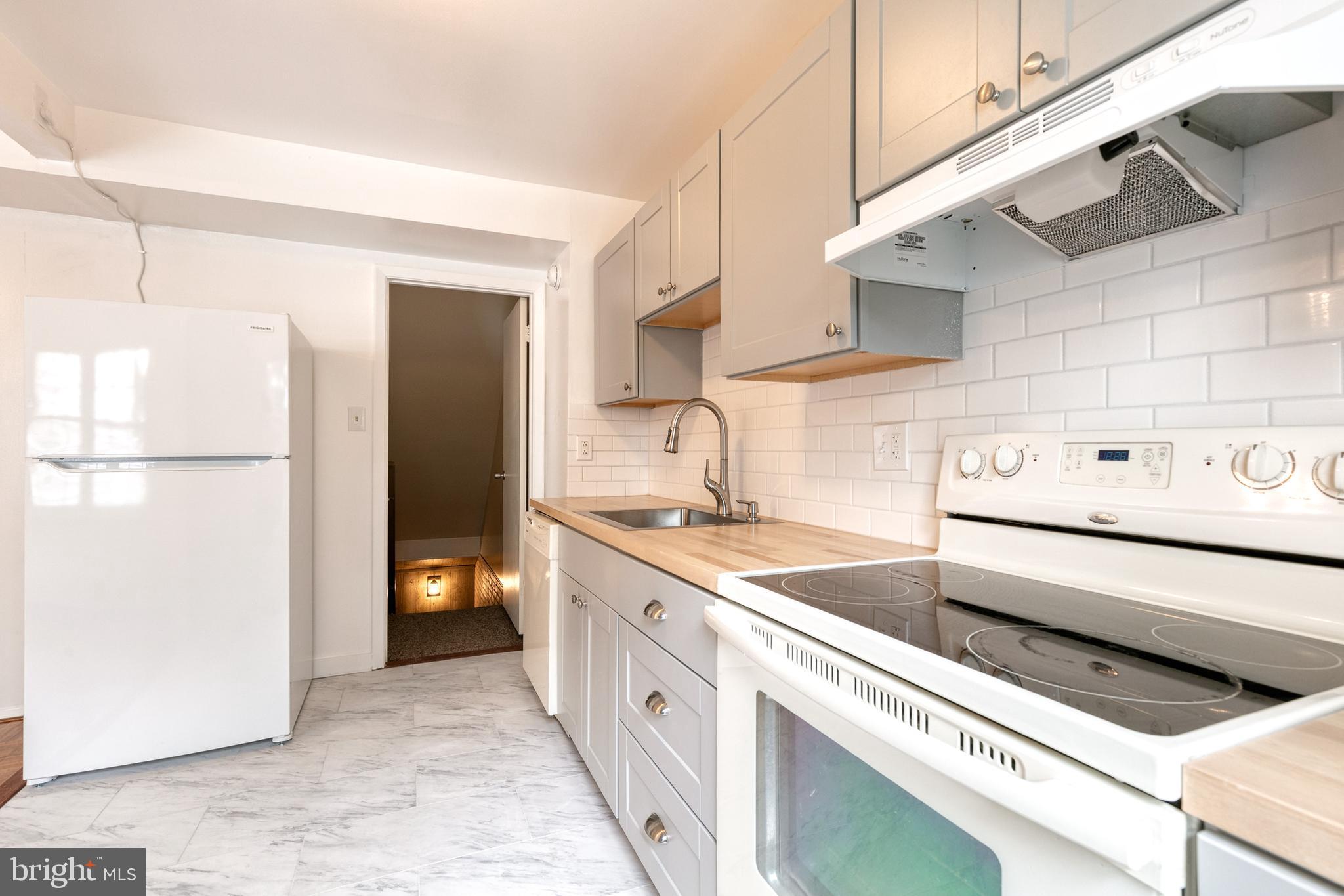 3429 Saluda Road Nottingham, MD 21236 - Photo 20 of 37 a kitchen with a stove and a refrigerator