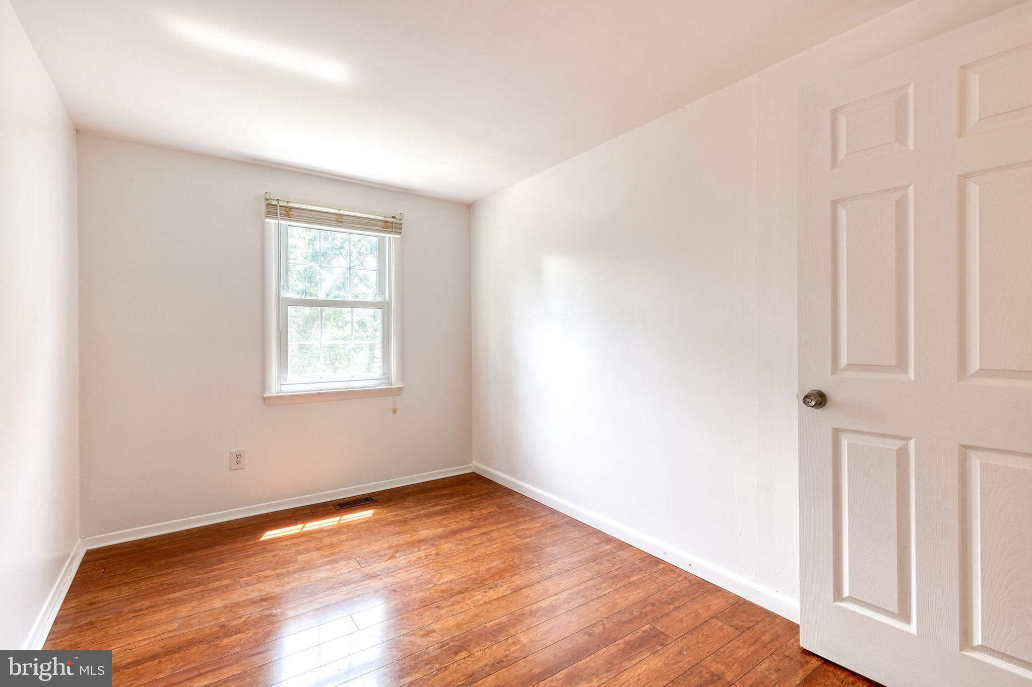3429 Saluda Road Nottingham, MD 21236 - Photo 25 of 37 an empty room with wooden floor and windows