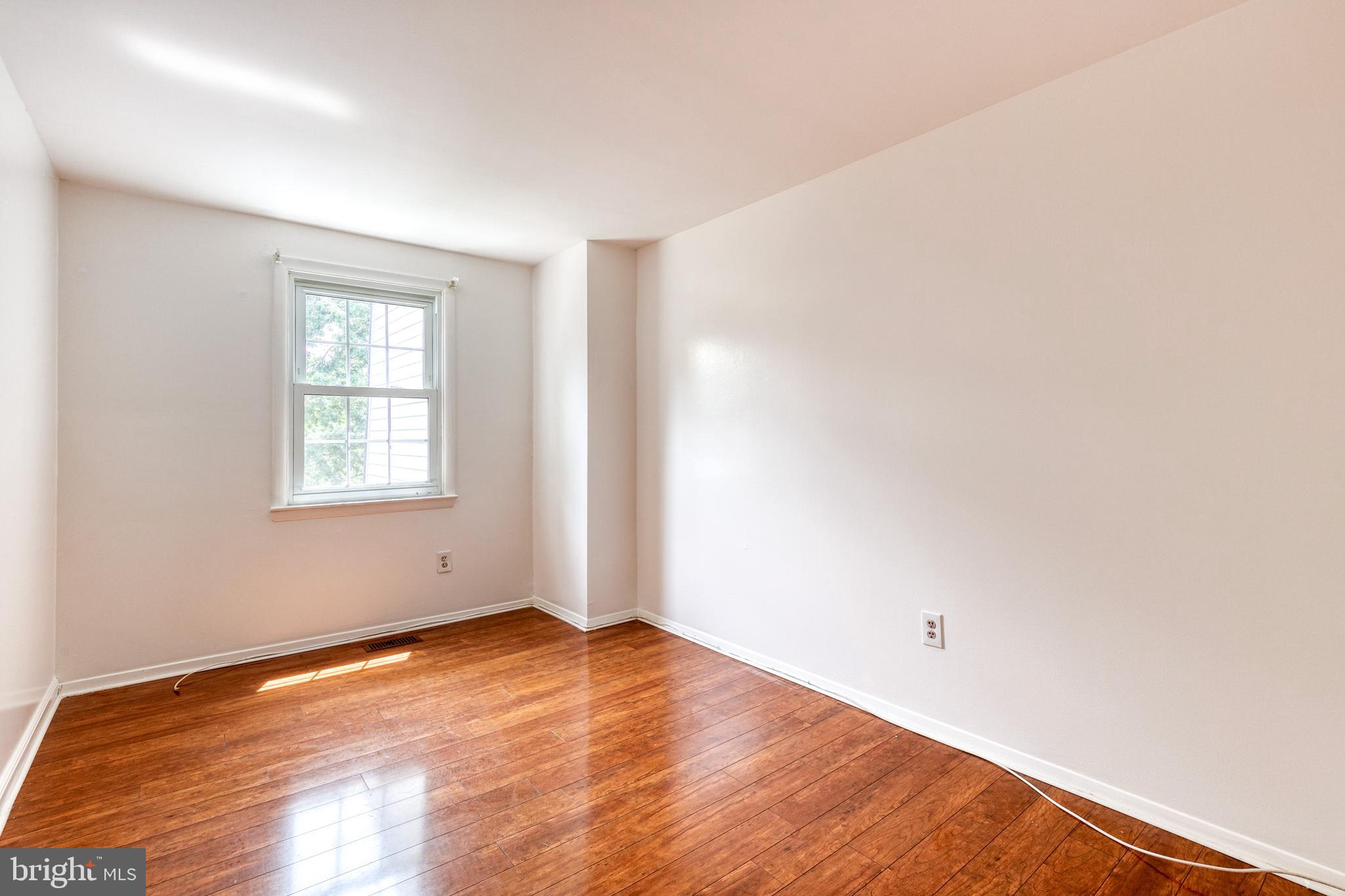 3429 Saluda Road Nottingham, MD 21236 - Photo 27 of 37 an empty room with wooden floor and windows