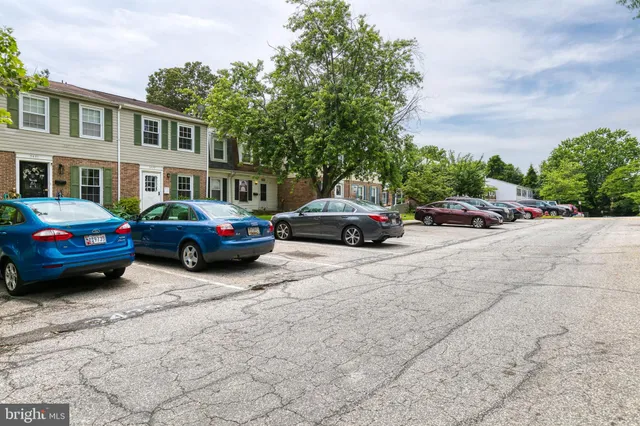 a view of cars parked in front of a building