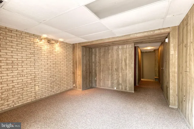 a bathroom with a sink mirror and toilet