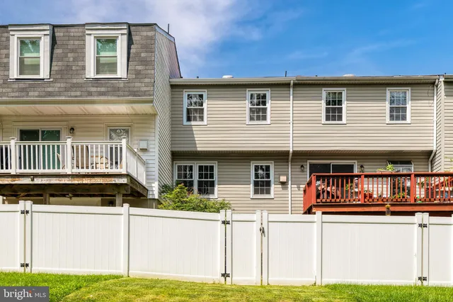a view of a swimming pool with an outdoor space and seating area
