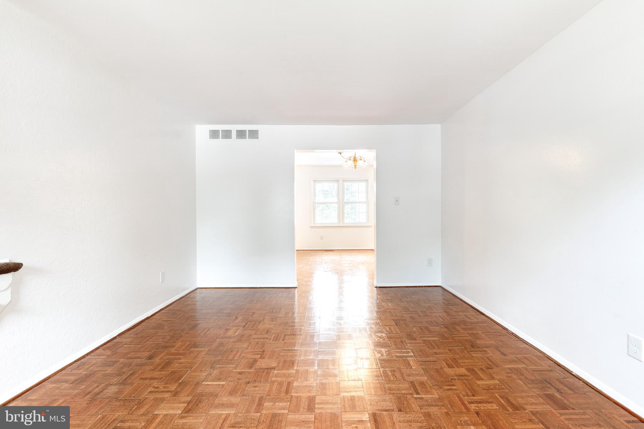 3429 Saluda Road Nottingham, MD 21236 - Photo 6 of 37 a view of a big room with wooden floor and windows